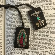 READY TO SHIP! Metallic hand-stitched scapular with Catholic symbols. Often worn in Mexico to protect from bad omens. Wool backing and colorful cord. Perfect as bracelets, necklaces, or as gifts. By purchasing this item, buyer agrees to shop policies (including no refunds or cancelations) and shipping dates. No exceptions. Items lost or damaged in mail are the responsibility of the buyer. All our scapulars are blessed with holy water, as shown in picture Catholic Cross Necklace, Scapular Necklace, Catholic Symbols, Catholic Bracelet, Catholic Decor, Bad Omens, Catholic Images, Graphic Poster Art, Christian Symbols