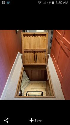 an open wooden chest sitting on top of a floor