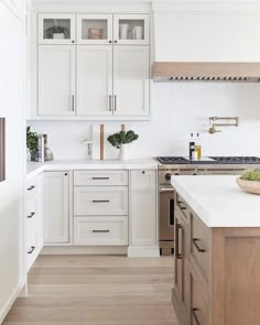 the kitchen is clean and ready for us to use it's white countertops