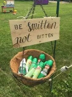 a wooden sign that says be smitten not bitten in front of some green toothpaste