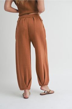 Women's Loose Pleated Joggers Drawstring Knit Lounge Pants Introducing our latest arrival: Drawstring Knit Lounge Pants! Available in two trendy colors, these pants boast a drawstring, convenient side pockets, pleated accents, and a cozy jogger style. Made with soft ribbed fabric, you'll never want to take them off. With a cute, cozy, and chic aesthetic, these pants feature a loose fit for maximum comfort. Complete the look by pairing them with our matching shirt (sold separately). Trust us, you Knitting Pants, Moroccan Oil Hair, Knitted Pants, Chic Aesthetic, Making Space, Long Sleeve Outerwear, Knit Bottom, Fashion Joggers, Sweater Pants