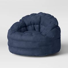 a blue bean bag chair sitting on top of a white floor