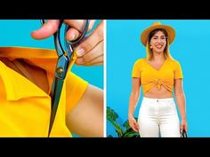 a woman in yellow shirt and white pants holding scissors