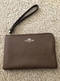 Coach Wristlet Single Corner Zip Leather Wristlet Wallet New with Tags Saddle 2. Condition is New with tags. MSRP $75.00 Shipped with USPS First Class in a bubble mailer Coach Wristlet With Zipper Closure For Evening, Classic Coach Wristlet With Zipper Closure, Brown Coach Wristlet Pouch, Coach Brown Wristlet With Zipper Closure, Coach Wallet With Zipper Closure For On-the-go, Coach Wristlet, Wristlet Wallet, Leather Wristlet, Wallet