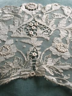 an image of lace on the back of a dress that is not in use yet