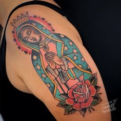 a woman's arm with a tattoo on it and a rose in the center