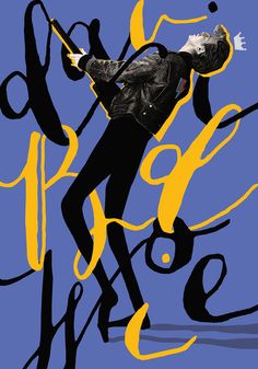 a man in black leather jacket standing next to yellow and blue graffiti type letters on a blue background