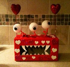 a red box with hearts and eyes on it