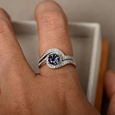 Alexandrite ring engagement rings 14k white gold ring | Etsy Anniversary Bridal Sets With Round Cut Accent Stones, Round Cut Bridal Sets With Accent Stones For Anniversary, Silver Bridal Sets With Diamond And Accent Stones, Silver Bridal Sets With Accent Stones For Anniversary, Silver Sapphire Ring With Tension Setting For Anniversary, Tanzanite Birthstone Ring For Anniversary, Round Cut, Silver Tanzanite Wedding Ring, Silver 14k White Gold Birthstone Ring With Halo Setting, Silver Tanzanite Birthstone Ring With Accent Stones