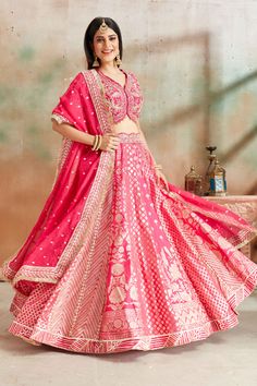 Go for a beautiful traditional look at weddings in this exquisite fuchsia pink embroidered Banarasi silk lehenga. The lehenga comes with a beautiful dupatta. Pink Anarkali Set With Intricate Embroidery In Art Silk, Pink Chanderi Lehenga With Traditional Drape, Pink Banarasi Silk Sharara With Traditional Drape, Pink Dola Silk Traditional Wear For Ceremonies, Pink Dola Silk Choli For Traditional Ceremonies, Pink Chanderi Lehenga With Zari Work, Pink Banarasi Silk Sharara, Pink Chanderi Lehenga For Navratri, Pink Choli With Pallu For Traditional Ceremonies