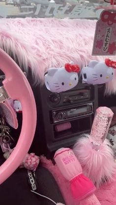 the interior of a car with hello kitty decorations