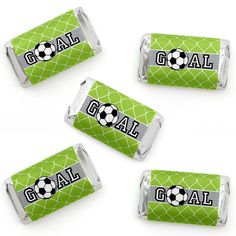 four soccer candy wrappers with the word goal on them