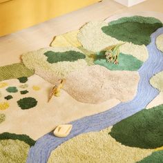 a living room area with rugs and carpeting on the floor, including a river running through it