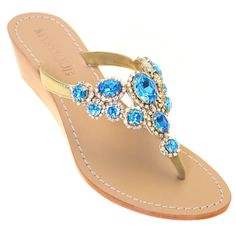 The Bluest blues of the ocean. Haiti is our beloved aqua blue gemstone sandals made on our lowest wedge height. This sandal features a 1.5 inch wedge. split Hand-Made & Made to Order (2-3 weeks) 100% Leather Sole Lined with Suede For Added Comfort Embellished with Czech Crystals & Rhinestone Chain 3 Wedge Heights Available: 1.5 inches, 2.5 inches, 3 inches Use Our “Change A Wedge” Button To Select The Wedge Height Of Your Choice Changing a Wedge Height Will Make Your Order Final Sale Ma Flat Shoes For Wedding, Blue Flat Shoes, Mystique Sandals, Blue Shoes Flats, Wooden Wedges, Blue Wedges, Crystal Sandals, Jeweled Sandals, Bridal Sandals