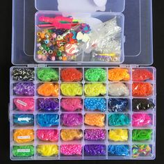 a plastic container filled with lots of different colored beads and accessories in it's storage compartment