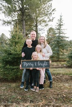 a family posing for a christmas card with the words merry and bright written on it