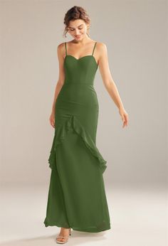 a woman in a long green dress