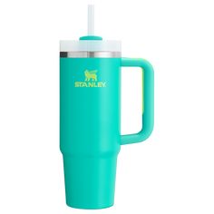 a blue travel mug with a straw sticking out of the lid and handle, on a white background