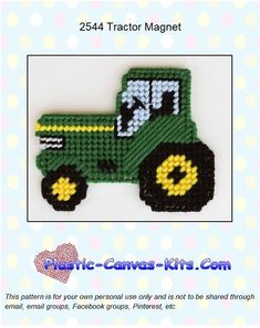 a green tractor with yellow wheels is shown