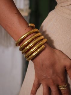 Introducing our enchanting Kambala Bangles, a captivating fusion of tradition and contemporary style. These exquisite bangles are handcrafted with an array of intricately designed brass beads, meticulously strung together to create a stunning visual symphony. The Kambala Bangles are designed with adjustability in mind, allowing you to find the perfect fit for your wrist. Their unique twist-on design ensures they stay securely in place while adding an elegant twist to your ensemble. Wearing these Bangles For Women, Brass Bangle, Bangle Bracelet Set, Brass Beads, Bohemian Accessories, Adjustable Bangle, Gold Bangles, Bangle Bracelet, Bracelet Set