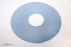 a white and blue circle on the wall