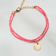 Available in a range of striking colours, our beautifully handwoven Personalized Braided Chain Bracelet is the perfect mix of sentiment and style, hand-engraved with your own special words.Available in 18K Champagne Gold PlatedAdjustable chain from 5.5 to 7Charm: 10mm diameter, 0.5mm thicknessSecure clasp fasteningCharm can't be removed from this chainHand-engraved in our London workshopSent with love in a complimentary gift boxAny slight variations in lettering depth, spacing and alignment from Handmade Yellow Gold Friendship Bracelet, Adjustable Pink Chain Bracelet Gift, Pink Adjustable Chain Bracelet Gift, Handmade Gold Friendship Bracelets For Personalized Gift, Handmade Adjustable Yellow Gold Name Bracelet, Adjustable Chain Bracelet With Tiny Beads As Gift, Adjustable Chain Bracelet With Tiny Beads For Gift, Adjustable Tiny Beads Chain Bracelet As Gift, Handmade Pink Chain Bracelet As Gift