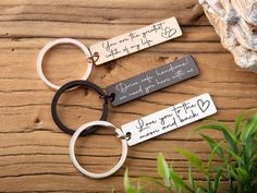 two keychains that say, you are the greatest gift for my husband and his wife