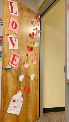 a door decorated with paper hearts and love letters