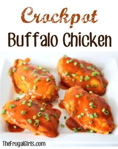 some chicken covered in sauce and green onions on a white plate with the words crockpot buffalo