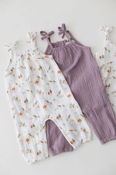 Perfect for your little one's everyday adventures, our organic cotton jumpsuit offers the perfect blend of style, comfort, and practicality. Crafted from soft, breathable organic cotton muslin, it's gentle on sensitive skin while keeping your child cool and comfortable all day long. Whether it's playtime, a casual outing, or a special occasion, our jumpsuit ensures your little one looks adorable and feels great. * Snap closure for quick & easy changes * Natural coconut shell buttons on the back Jersey Knit Headband, Straps Jumpsuit, Cotton Jumpsuit, Everyday Adventures, Gender Neutral Baby Clothes, Muslin Fabric, Shell Buttons, Coconut Shell, Cotton Muslin