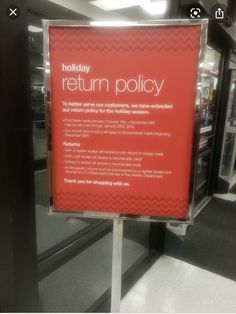 a holiday return policy sign in an airport