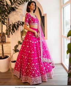 Bollywood Replica GownLehenga in Heavy Tapeta Silk with Heavy Embroidery 3mm Sequence Work *(Canvas Patta)* with flair  3 Mtrs ,choli in 1 Mtr Un Stitched Tapeta Silk with Heavy  Embriodery and 3mm Sequence Work With Sleeves *(Choli Inner Micro Cotton 0.80 CM)* , dupatta in 2.20 Mtrs Soft Butterfly Net with Embriodery and 3mm Sequence Work With 2 Pallu Side Fency Pipas Lace Border .Semi stitch lehenga that can be stitched to sizes till 42 inch.Shipping time 5-7 daysBuy this Saree at Ko Pink Lehenga Choli, Lehenga Pink, Pink Bridal Lehenga, Lehenga Choli Designs, Cotton Lehenga, Rani Pink, Bollywood Lehenga, Lengha Choli, Lehenga Wedding