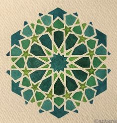 a green and white design on paper with watercolor pencils in the shape of a star