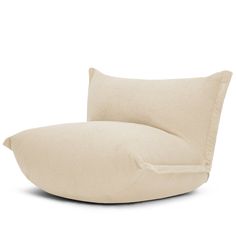 a white pillow sitting on top of a chair