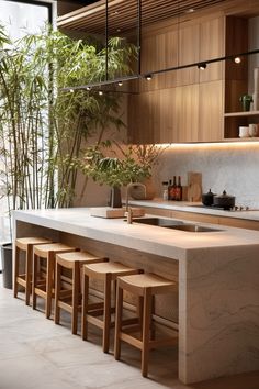 a kitchen counter with stools next to it and bamboo trees in the back ground