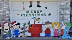 a garage door decorated with peanuts and christmas decorations