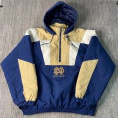 Vintage 2000s Notre Dame University College Sportswear Athletic Stitched Y2K Aesthetic Multi Color Half Zip Up Hooded Jacket Extra Large Men Condition:  Fair Used Condition  = Staining On The Sleeve Due To Age And Wear  Measurements: Please see photos above for all measurements IF YOU BUY TWO OR MORE ITEMS USE THE CODE BUNDLE @ CHECK TO SAVE 20% WE SHIP WITHIN 24 HOURS AFTER PURCHASE! Please be aware that we do not offer free returns!! The Buyer is responsible for the cost of the return label. F Throwback Winter Track Jacket For Sports, Hooded Nylon Track Jacket For Sports Season, Urban Hooded Windbreaker For Sports Events, Nylon Hooded Windbreaker For Sports Season, Hooded Nylon Windbreaker For Sports Season, Winter Nylon Outerwear For Sports Events, 90s Style Sports Windbreaker For Fall, 90s Style Fall Sports Windbreaker, Hooded Patchwork Track Jacket For Streetwear