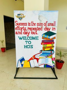 a sign that is sitting on the ground in front of a building with a bunch of books