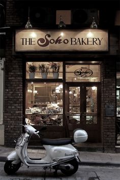 a scooter is parked in front of the store