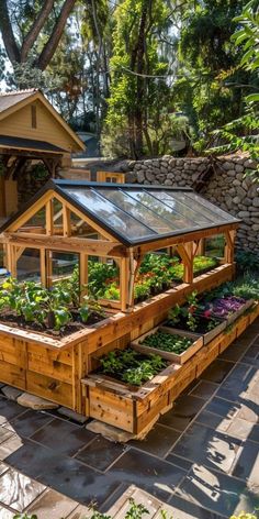 an outdoor garden area with raised wooden planters