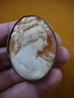 (Internal #C-1352)  Excellent, vintage genuine carved shell cameo of a Formidable woman, hair up, PIN/PENDANT (retractable); 2” long x 1-5/8” wide, Setting is white gold, marked “800”, it is a gold mark from Portugal, about 19k, used from 1938-1984.CIRCA 1920-1940 unless marked.WE SHIP WORLDWIDE! Other accepted payment: Credit card (Mastercard/Visa/Discover) inquire for details. Woman Hair, Brass Pin, Gold Pin, Vintage Cameo, Carved Shell, Brooch Necklace, Pin Pendant, White Rhinestone, Up Hairstyles