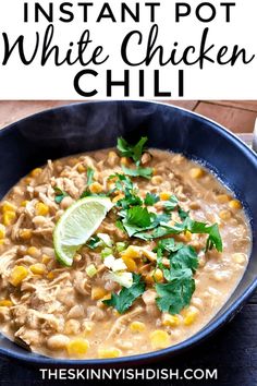 instant pot white chicken chili in a blue bowl with cilantro and lime garnish