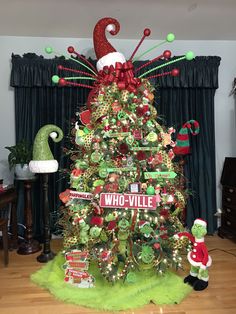 a decorated christmas tree in the corner of a room