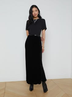 The Zeta maxi skirt is a true L’AGENCE icon and all-season bestseller. Versatile, chic, and minimalist, she’s an essential for every wardrobe. • Silk-infused velvet fabric • Bias-cut• Elastic waistband• Unlined• No closures | L'AGENCE Zeta Velvet Maxi Skirt In Velvet Black Velvet Midi Skirt Black, Soft Natural Kibbe Wardrobe, Maxi Velvet Skirt Outfit, Style Black Silk Skirt, Black Women Office Wear, Black Silk Maxi Skirt Outfit, Velvet Maxi Skirt Outfit, Maxi Skirt Work Outfit, Black Velvet Skirt Outfit