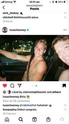 two men sitting in the back seat of a car, one with no shirt on