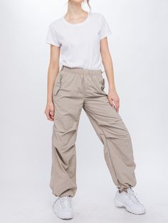 90s Style Baggy Parachute Trousers, 90s Baggy Parachute Trousers, Sporty Stretch Cargo Style Parachute Pants, Sporty Stretch Cargo Parachute Pants, 90s Style Parachute Trousers For Spring, Sporty Parachute Pants For Hiking In Spring, Spring Hiking Nylon Pants, 90s Cargo Style Wide Leg Parachute Pants, Casual Nylon Full-length Parachute Pants