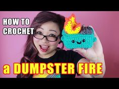 a woman is holding up a crocheted dumpster fire item with the words how to crochet on it