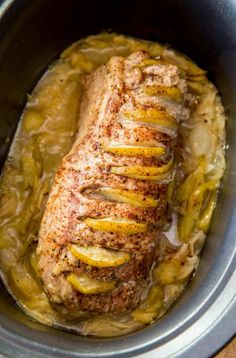 pork roast with potatoes and gravy in the slow cooker, ready to be cooked