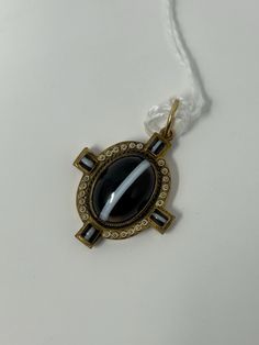 This elegant pendant is a stunning example of Victorian jewelry. The banded agate and enamel design is accented with 14k gold, making it a beautiful addition to any collection. Its unique style and material make it a rare find for any jewelry enthusiast. The pendant is perfect for anyone who appreciates the beauty of vintage jewelry and wants to add a touch of history to their collection. Luxury Enamel Oval Pendant Jewelry, Luxury Oval Pendant Enamel Jewelry, Elegant Oval Enamel Jewelry, Formal Enamel Oval Pendant Jewelry, Antique Enamel Pendant Jewelry, Luxury Enamel Locket Jewelry, Art Deco Enamel Round Jewelry, Luxury Enamel Pendant Jewelry, Art Deco Round Enamel Jewelry