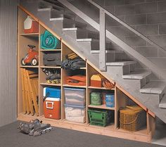 an under the stairs storage area with various items